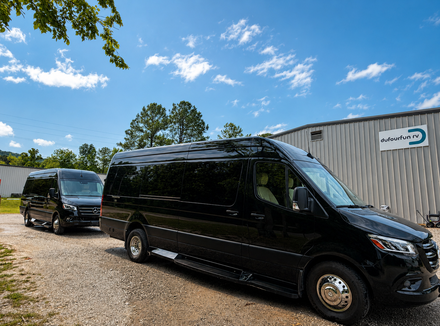 Two black Dufourfun Sprinter vans at the Leeds, AL headquarters
